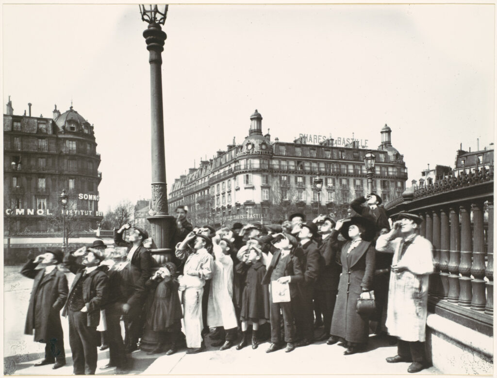 Eugène Atget, People Watching an Eclipse, Embankment of the Place de la Bastille Towards Rue Saint-Antoine, 1912, printed 1956 Gelatin silver print from glass negative Metropolitan Museum of Art, New York